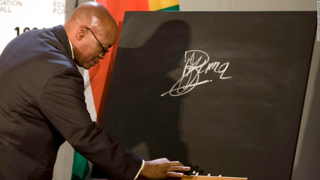Zuma signs a blackboard in October 2009, pledging South Africa&#39;s support for a global campaign to ensure education for all the world&#39;s children.