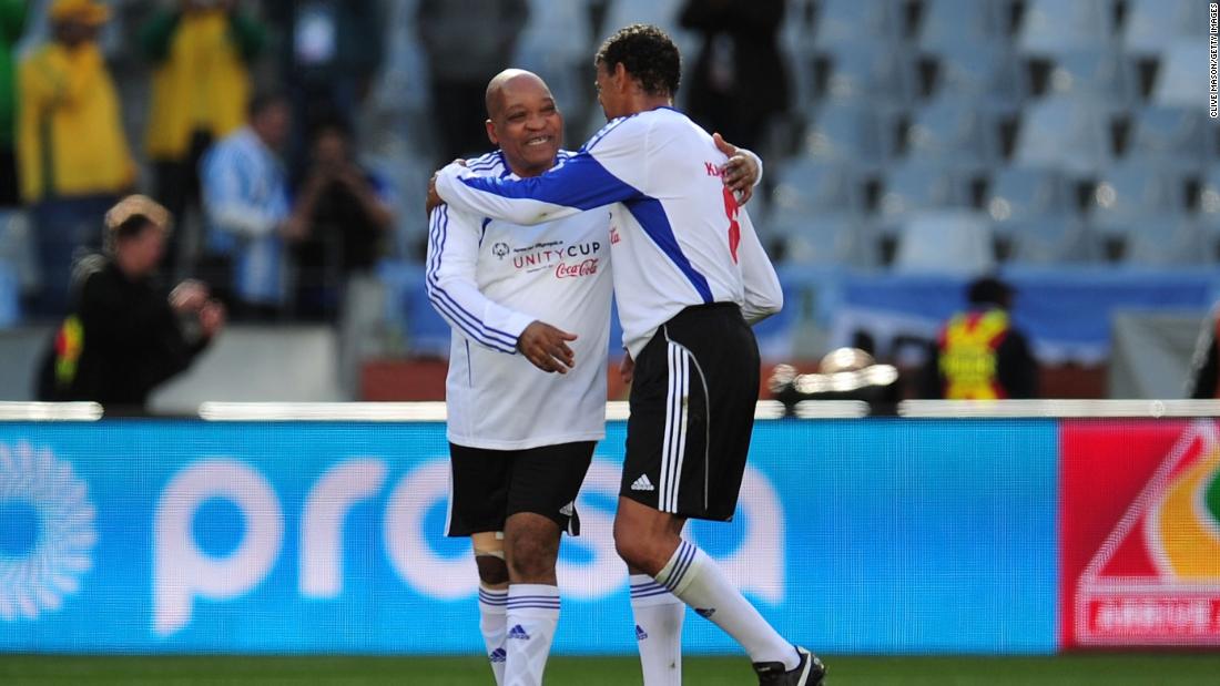 Zuma, left, and Sky Sports commentator Chris Kamara play a charity soccer match in Cape Town, South Africa, in July 2010.