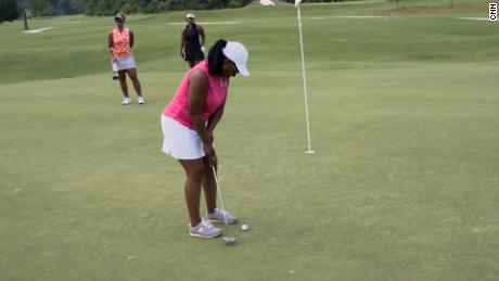 Tiffany Fitzgerald demonstrates putting in a Black Girls Golf clinic.