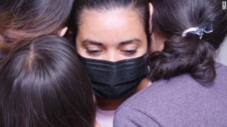 Juana hugs three of her daughters, about a month after they were reunited in the United States.
