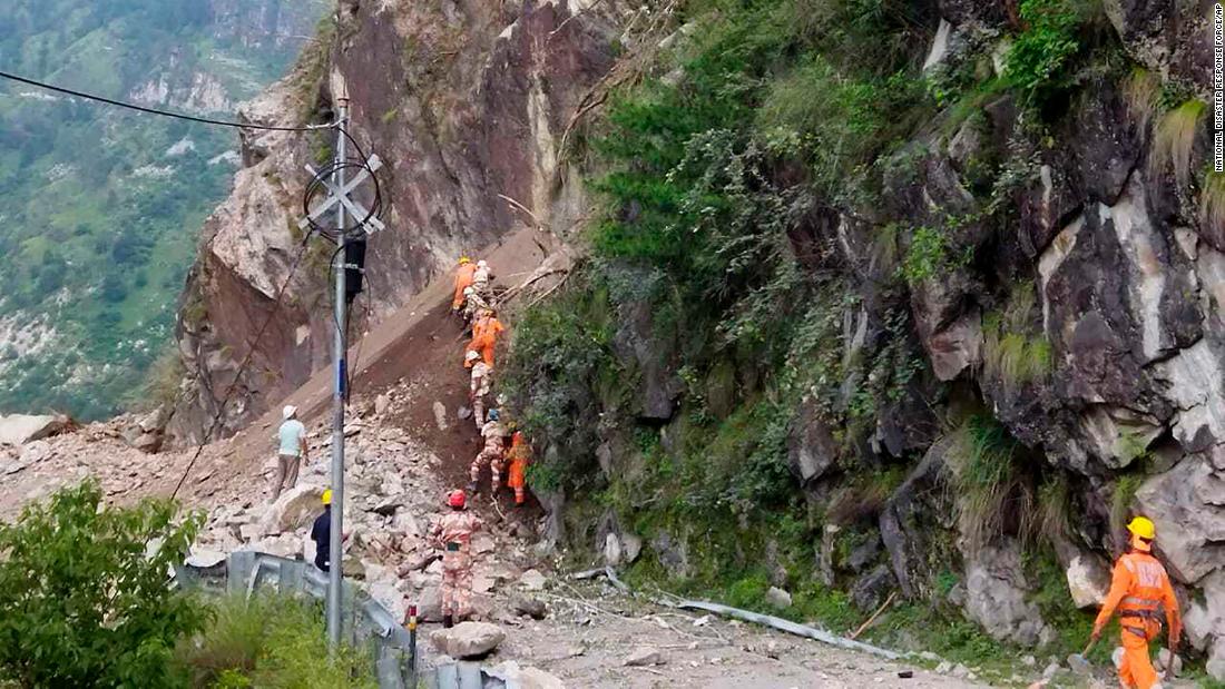 At least 13 dead and dozens trapped after landslide hits highway in northern India