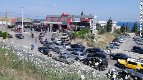 Vehicles line up at a petrol station in the Balamand area on the coastal highway linking Lebanon&#39;s capital to the country&#39;s north, on June 21, 2021 amid dire fuel shortages.