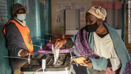 A woman casts her ballot in Lusaka after a tense campaign dominated by economic woes.