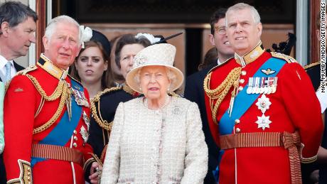 The Queen stands alongside Princes Charles and Andrew during a Buckingham Palace flypast in 2019. 