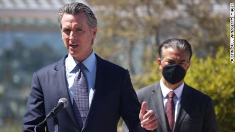 California Gov. Gavin Newsom speaks as California Attorney General Rob Bonta, at right, looks on during a news conference at San Francisco General Hospital on June 10.