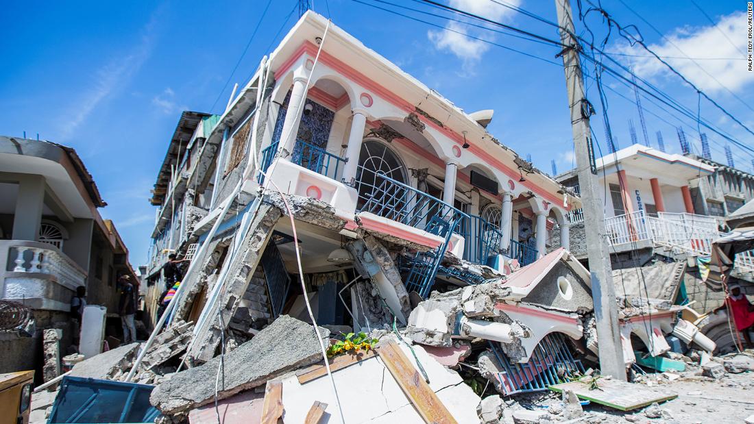 A house sits on top a pile of rubble following a 7.2-magnitude earthquake in Les Cayes, Haiti on August 14.