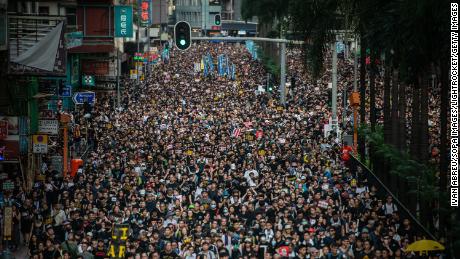 Demonstrators march during the Civil Human Rights Front march in Wan Chai, Hong Kong, on Sunday, July 21, 2019. 