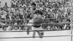July 5 1975: Ali fights Hungarian-born British boxer Joe Bugner in their title fight at the Merdeka Stadium in Kuala Lumpur. Ali won the fight to keep his world heavyweight title. 
