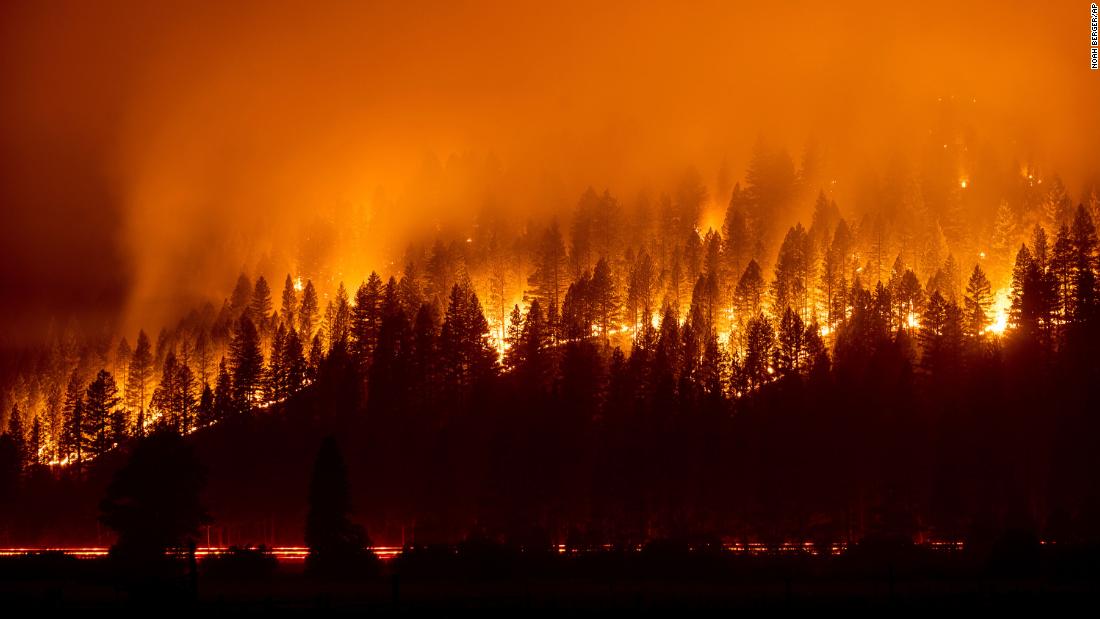 Crews battle western wildfires that have caused thousands of evacuations