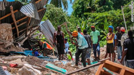 Haiti death toll rises as tropical storm hits earthquake area