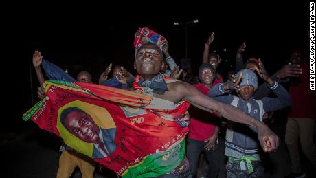 Supporters of Zambian presidential candidate for the opposition party United Party for National Development (UPND) Hakainde Hichilema celebrate his election as Zambian President in Lusaka, on August 16, 2021.