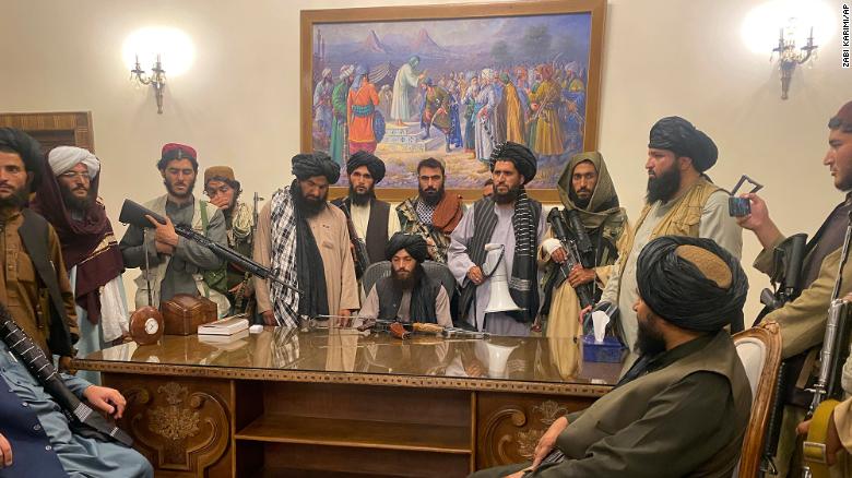 Taliban fighters take control of the Afghan presidential palace in Kabul, Afghanistan, on August 15, 2021.