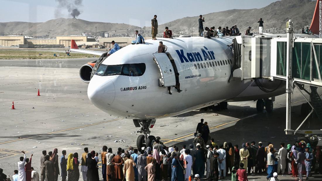 People climb atop a plane at Kabul's international airport after the Taliban retook the capital a day earlier. Hundreds of people&lt;a href=&quot;https://www.cnn.com/2021/08/16/middleeast/kabul-afghanistan-withdrawal-taliban-intl/index.html&quot; target=&quot;_blank&quot;&gt; &lt;/a&gt;poured onto the tarmac, &lt;a href=&quot;https://www.cnn.com/2021/08/16/middleeast/kabul-afghanistan-withdrawal-taliban-intl/index.html&quot; target=&quot;_blank&quot;&gt;desperately seeking a route out of Afghanistan.&lt;/a&gt;