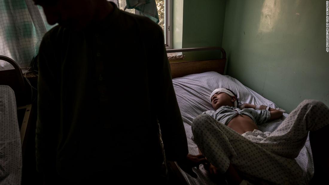 Hanif, who was struck in the temple by a stray bullet, and his older brother, Mohammed, are seen at the Mirwais Regional Hospital in Kandahar on August 5. Kandahar had been under siege for a month.