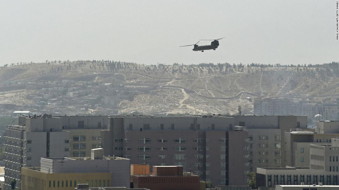A US military helicopter flies above the US Embassy in Kabul on August 15. The embassy was evacuated as Taliban fighters entered the city.