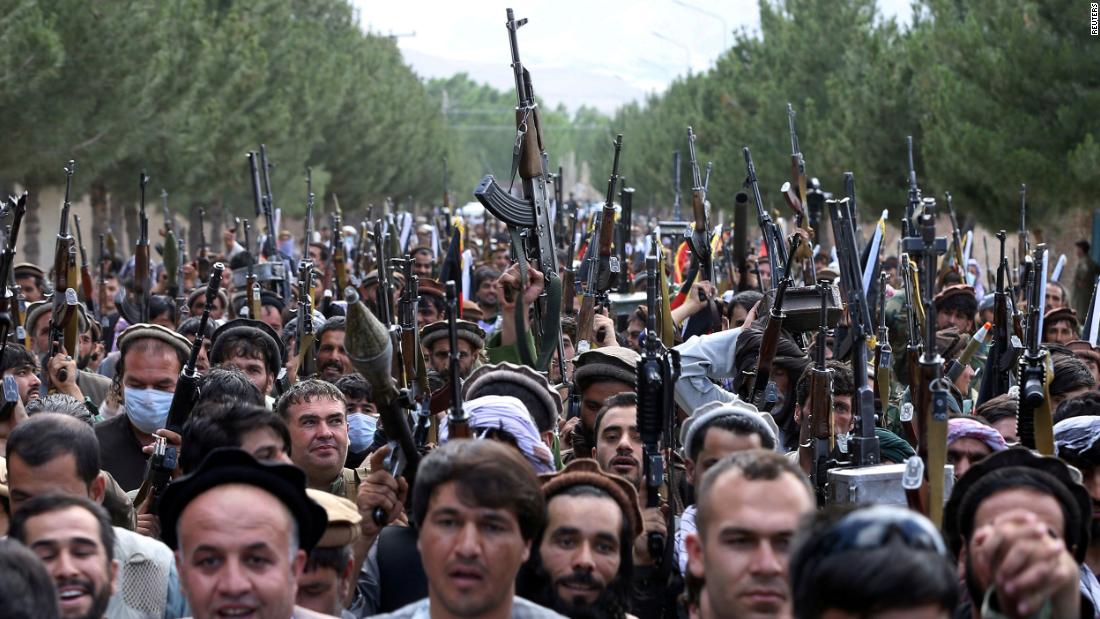 Hundreds of armed men attend a gathering on the outskirts of Kabul on June 23 to announce their support for Afghan security forces and say that they are ready to fight against the Taliban.