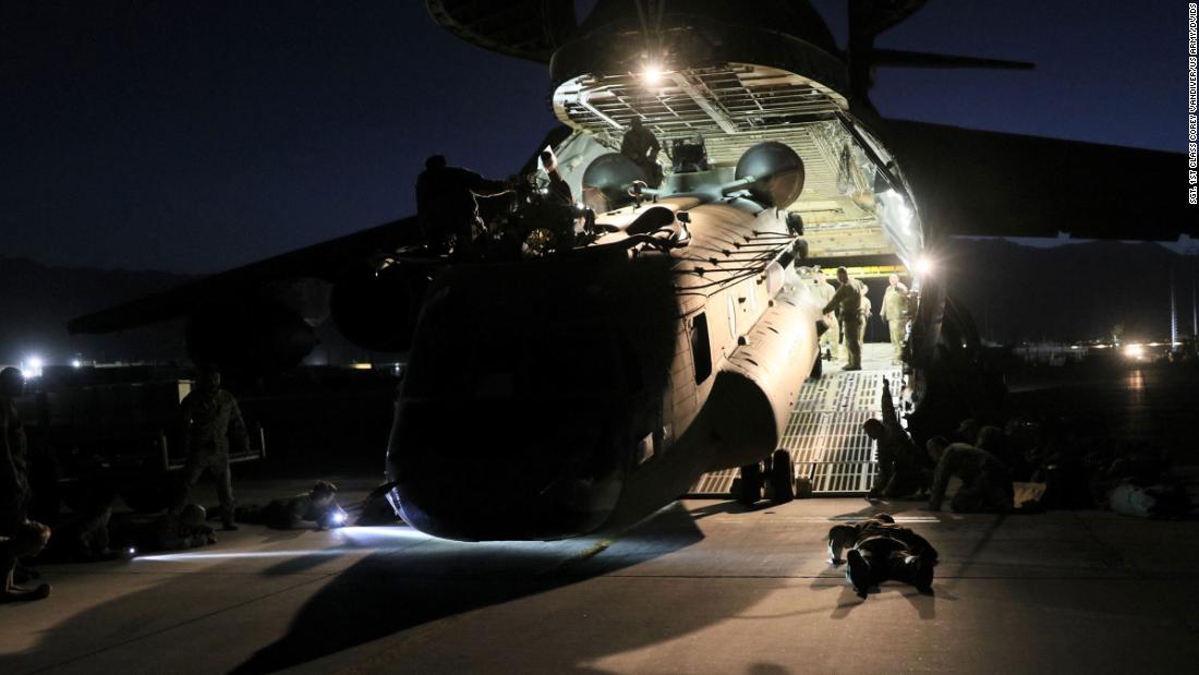 A helicopter is loaded onto a US Air Force plane as American forces carry out their withdrawal from Afghanistan on June 16. 
