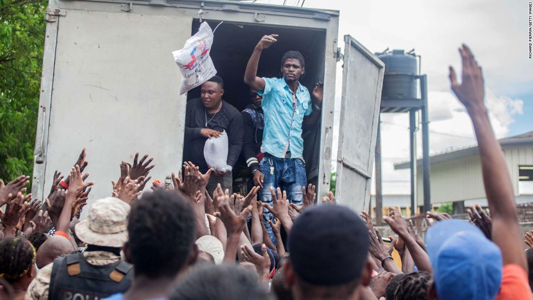 A crowd in Les Cayes waits to receive humanitarian aid provided by the Fund for Economic and Social Assistance.