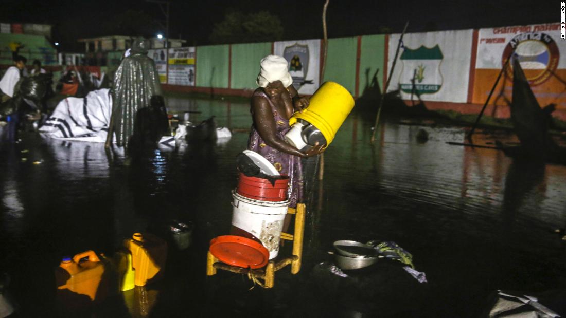 A woman recovers her belongings at a flooded refugee camp. Emergency officials were bracing for heavy rains and floods as &lt;a href=&quot;https://www.cnn.com/2021/08/16/americas/haiti-earthquake-news-monday-intl/index.html&quot; target=&quot;_blank&quot;&gt;Tropical Depression Grace&lt;/a&gt; moved toward Haiti.