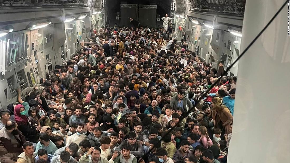 Evacuees crowd the interior of a US Air Force transport plane as they travel from Kabul to Qatar on August 15.