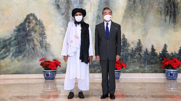 Taliban co-founder Mullah Abdul Ghani Baradar, left, and Chinese Foreign Minister Wang Yi in China on July 28, 2021.