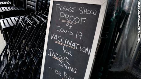 A sign at a NYC restaurant reads &quot;Please show proof of Covid-19 vaccination for indoor dining ... or bar.&quot; 
