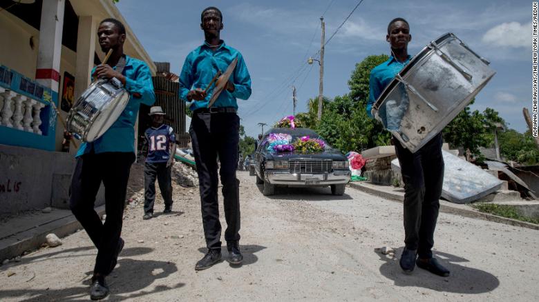 A funeral procession is held for an earthquake victim in L&#39;Asile, Haiti, on Wednesday, August 18.