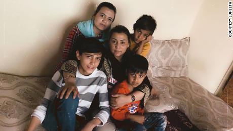 She's constantly calling her four young children who are hiding in a Kabul apartment