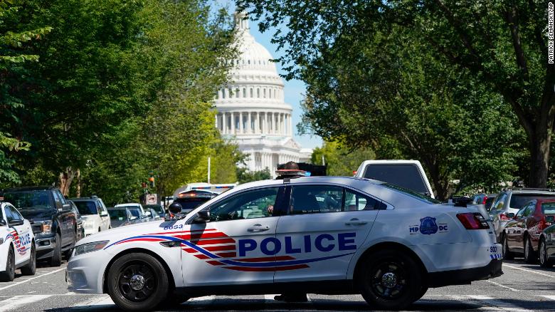 A Metropolitan Police Department cruiser blocks a street near the US Capitol and a Library of Congress building in Washington on Thursday, Aug. 19, 2021, as law enforcement officials investigate a report of a pickup truck containing an explosive device.