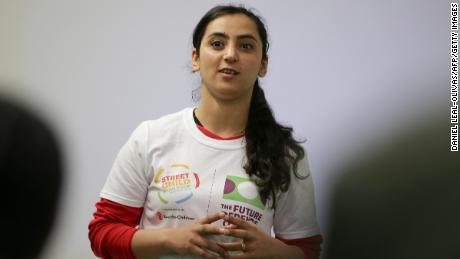 Former Afghanistan women&#39;s football captain Khalida Popal speaks during a motivational session with young women in south London on March 30, 2018.
Former Afghanistan women&#39;s football captain Khalida Popal fled her country after receiving death threats but it has far from cowed her in fighting the prejudice which confronts women daily, she told AFP. The 30-year-old -- who has been based in Denmark since 2011 -- takes her message round the world and spoke after giving an inspirational talk to the girls of Team England who will compete in the Street Child World Cup in Moscow later this year. Popal said women could achieve anything, a belief she formed when as a child a group of men refused to give back the football she was playing with, saying girls had no right to take part in sport. / AFP PHOTO / Daniel LEAL-OLIVAS        (Photo credit should read DANIEL LEAL-OLIVAS/AFP via Getty Images)