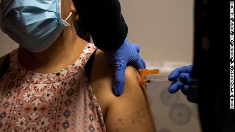 Medical Assistant Lucy Cruz injects the vaccine into the arm of a patient at Lancaster Family Health Center in Salem, Oregon on August 19, 2021.