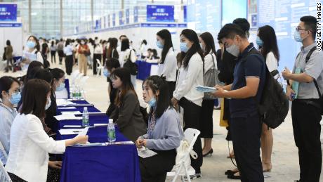 University graduates crowd at a job fair at Shenzhen Convention and Exhibition Center on October 10, 2020, in Shenzhen, Guangdong province of China. 