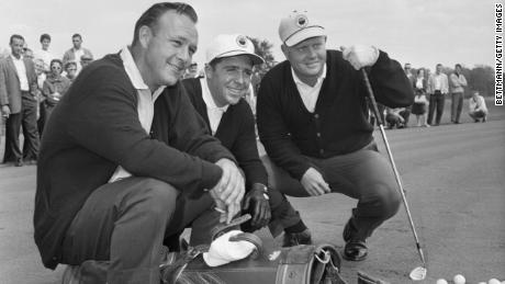 Palmer, Player and Nicklaus pose with their golf clubs before practice at the Firestone Country Club in Akron, Ohio.