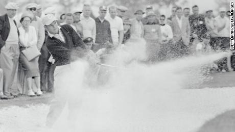 Palmer fires from the bunker of the seventh hole of the Desert Inn Country Club.