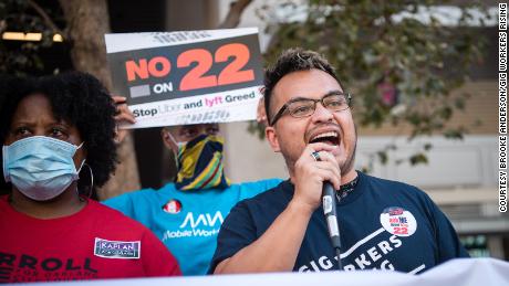 A Gig Workers Rising demonstrator speaks during a protest against Californi&#39;s Prop. 22 in 2020.