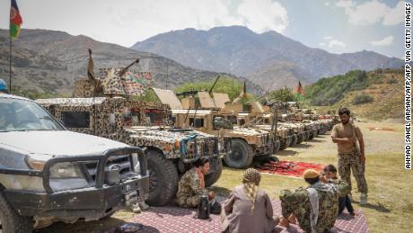 Afghan security forces stand with their weapons and Humvee vehicles at Parakh area in Bazarak, Panjshir province on August 19, 2021.