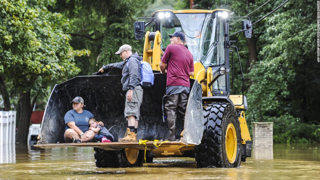 Andrea Fuchs, her daughter Sozey and her husband Saun are taken to her parents&#39; home in Monroe, New Jersey, by the city&#39;s department of public works.