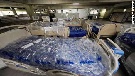 Beds await placement in a yet to be completed section of a COVID-19 mobile field hospital erected in a parking garage at the University of Mississippi Medical Center in Jackson.