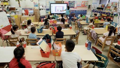 Melissa Moy, a teacher at Yung Wing School PS 124, takes a lesson on an instructor with summer program students in person on July 22 in New York City.