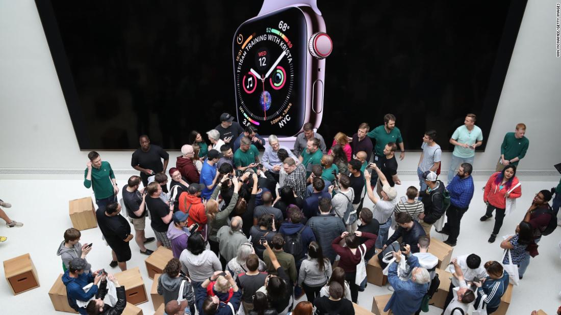 Cook welcomes customers to the opening of a new Apple Store at the historic Carnegie Library building in Washington, DC, on May 11, 2019. The location represented Apple&#39;s most extensive restoration project to date, renovating what was once the city&#39;s Central Public Library.