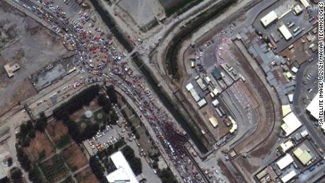 A satellite image shows crowds at a gate to Kabul&#39;s airport on August 23 in Afghanistan.