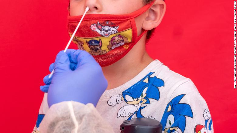 A boy receives a mandatory COVID-19 test at Northridge Middle School on August 11.