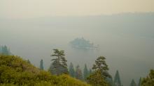 Lake Tahoe&#39;s Emerald Bay is shrouded in smoke from the Caldor Fire, near South Lake Tahoe, Calif., Tuesday, Aug. 24, 2021. The massive wildfire, that is over a week old, has scorched more than 190 square miles, (492 square kilometers) and destroyed hundreds of homes since Aug. 14. It is now less than 20 miles from Lake Tahoe. (AP Photo/Rich Pedroncelli)