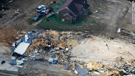 Damaged homes and cars are seen in Waverly, Tennessee on Wednesday.