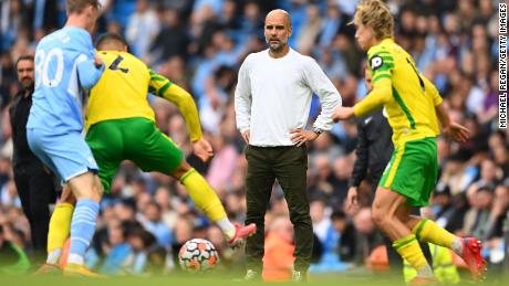 Guardiola looks on during the Premier League match between Manchester City and Norwich City.