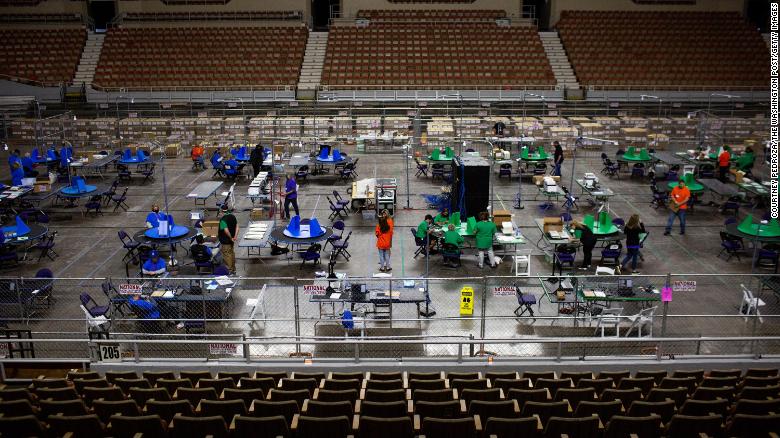 Contractors working for Cyber Ninjas, which was hired by the Arizona State Senate, examine and recount ballots from the 2020 general election on May 3, 2021 in Phoenix, Arizona. 