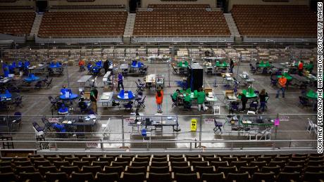 Contractors working for Cyber Ninjas, which was hired by the Arizona State Senate, examine and recount ballots from the 2020 general election on May 3, 2021 in Phoenix, Arizona. 