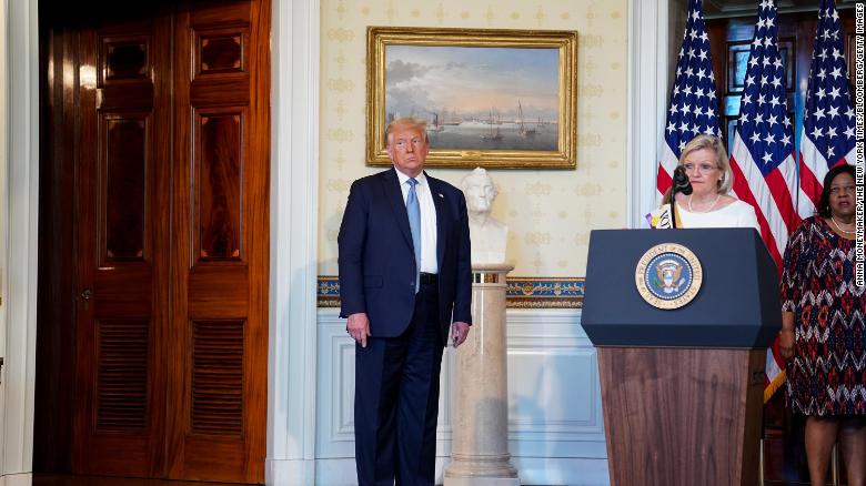 Cleta Mitchell speaks during an event marking the 100th Anniversary of the 19th Amendment ratification with President Donald Trump, left, in the Blue Room of the White House on August 18, 2020.