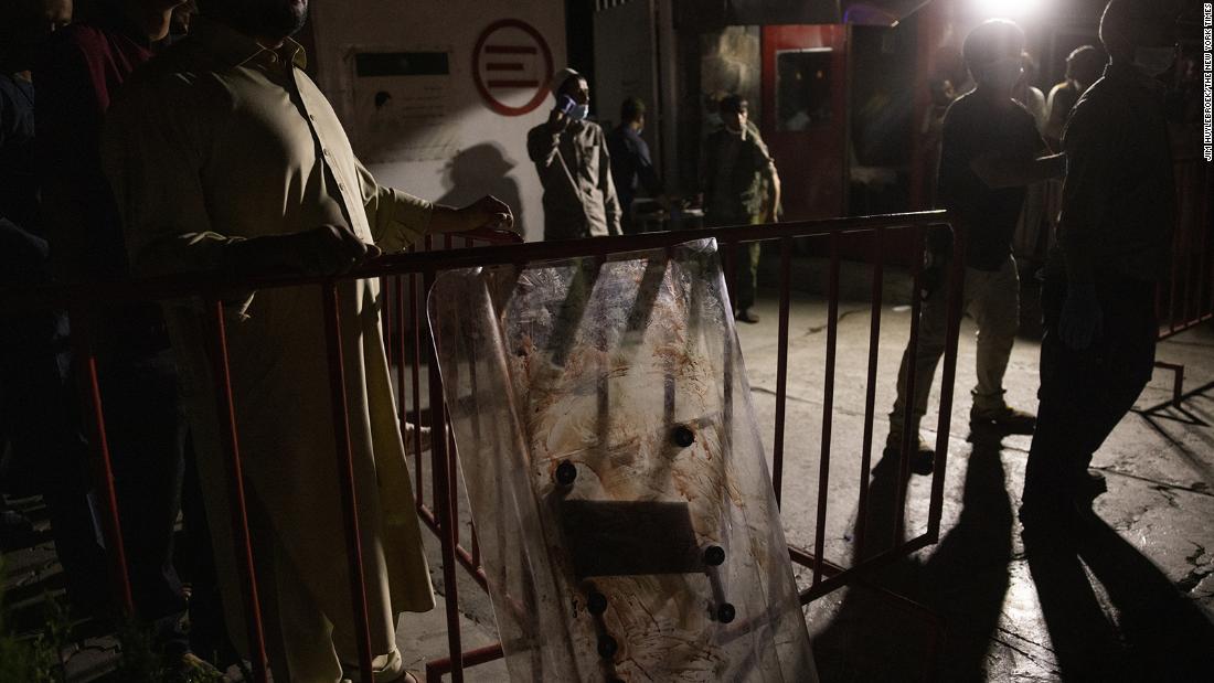 A bloodied shield stands outside the entrance of a Kabul hospital after Thursday&#39;s bomb attacks.