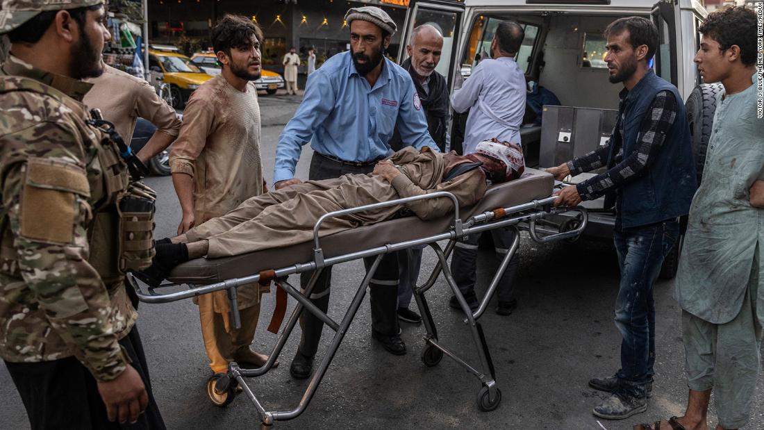 An injured person arrives at a hospital after &lt;a href=&quot;https://www.cnn.com/2021/08/26/asia/afghanistan-kabul-airport-blast-intl/index.html&quot; target=&quot;_blank&quot;&gt;suicide bomb attacks&lt;/a&gt; caused casualties outside the international airport in Kabul, Afghanistan, on Thursday, August 26.